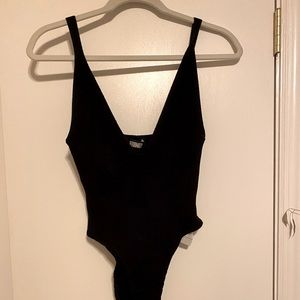 Reformation body suit. Black. Ribbed. Size M